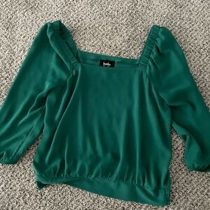 100% Polyester top with 3/4 length sleeves.  Only worn one time